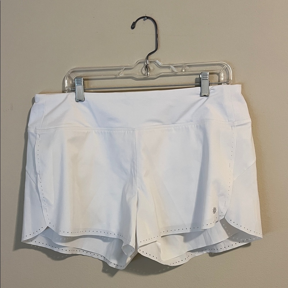 Women's White Athleta Laser Cut 4” running short.